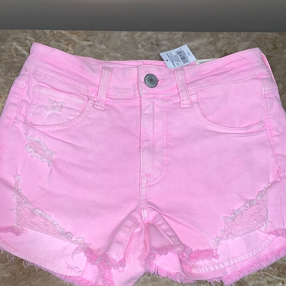 Pink slightly distressed shorts